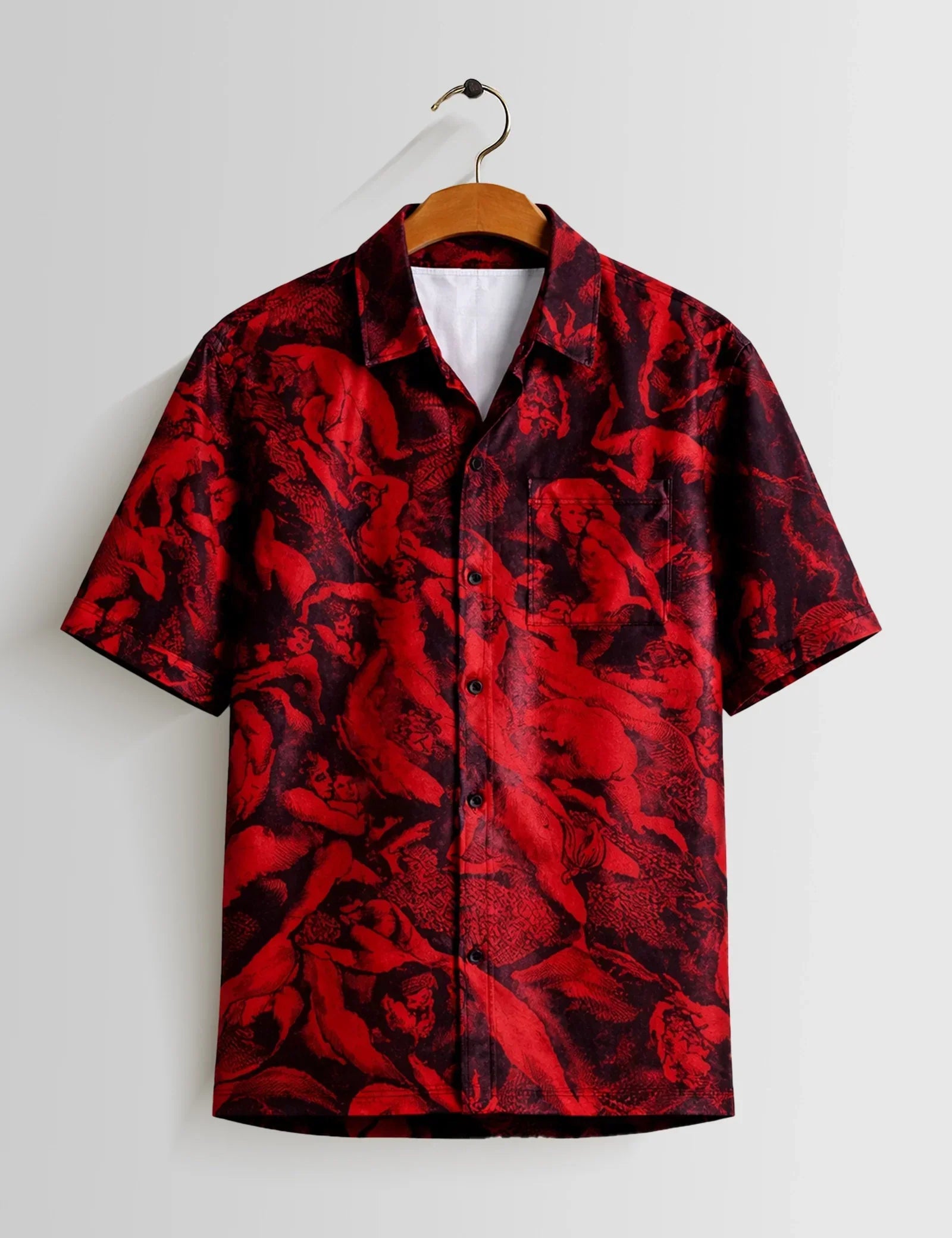 Red and black patterned shirt on a hanger against a white background