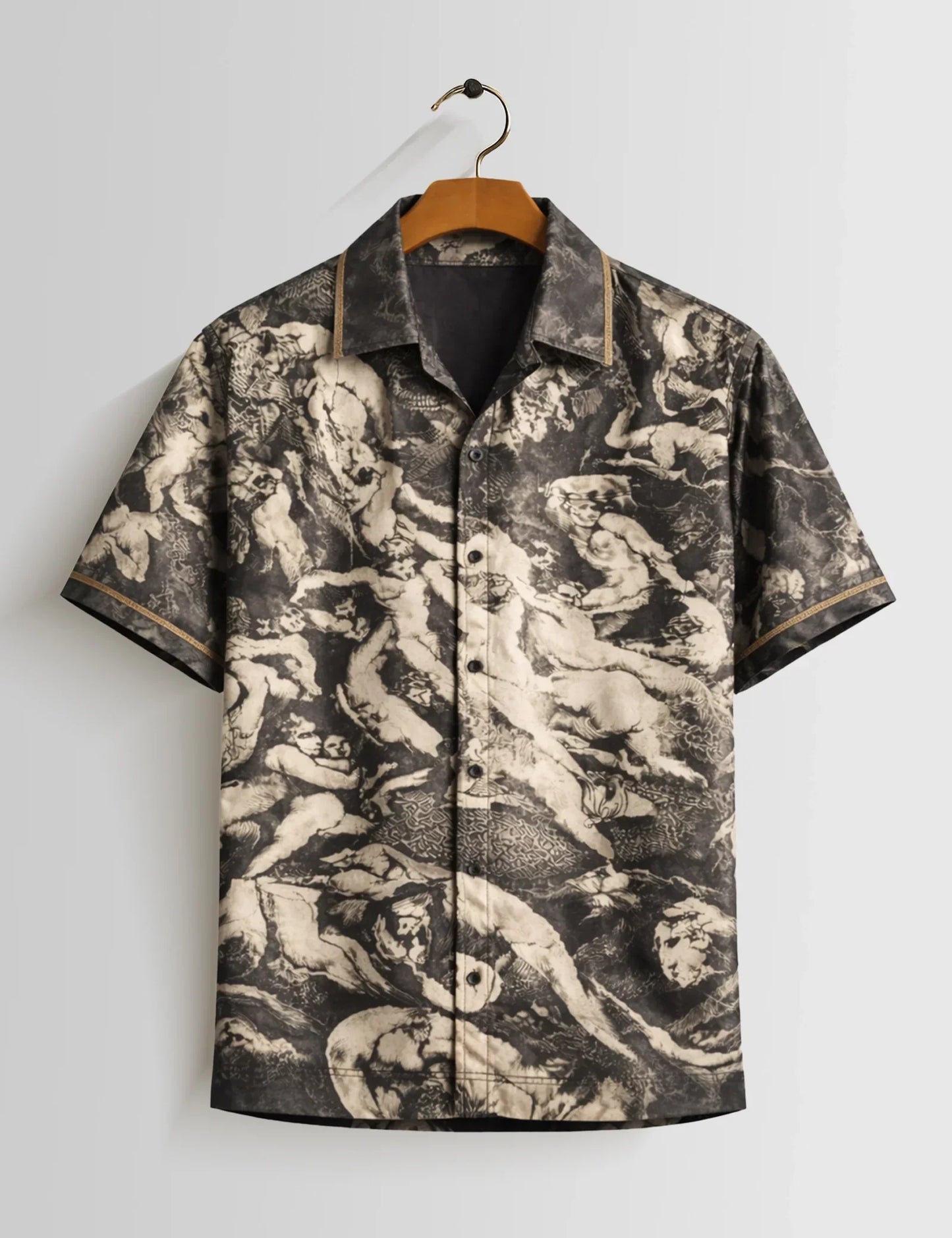 Short-sleeve shirt with a unique pattern on a hanger against a light gray background